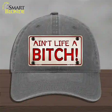 Aint Life A Bitch Novelty License Plate Hat Unconstructed Cotton / Charcoal