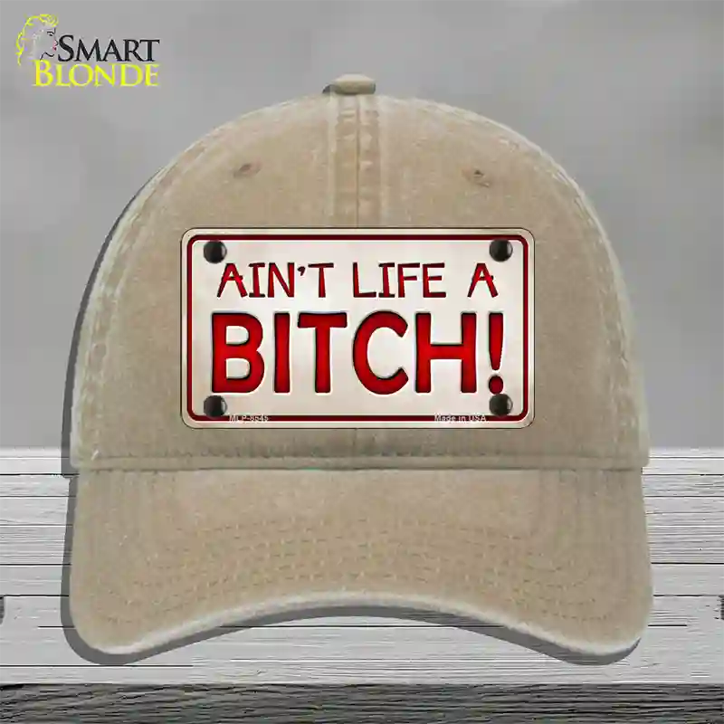 Aint Life A Bitch Novelty License Plate Hat Unconstructed Cotton / Khaki