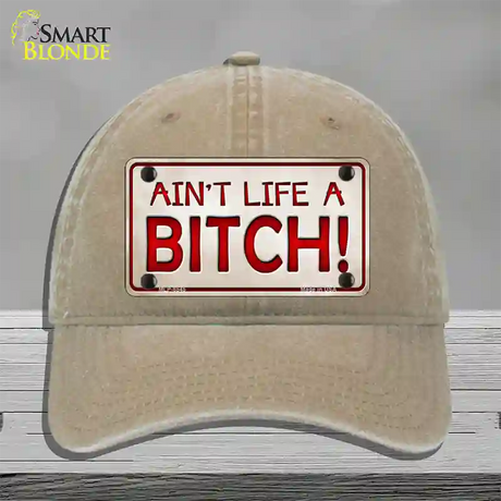 Aint Life A Bitch Novelty License Plate Hat Unconstructed Cotton / Khaki