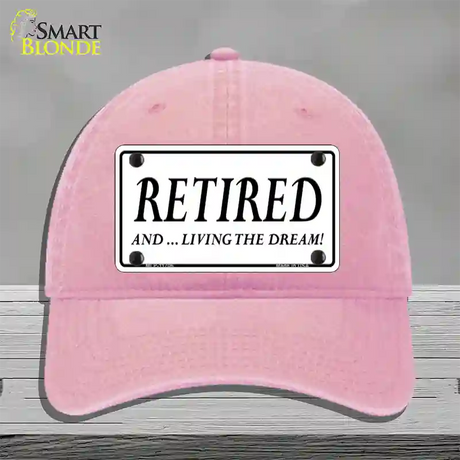 Retired And Living The Dream Novelty License Plate Hat Unconstructed Cotton / Pink