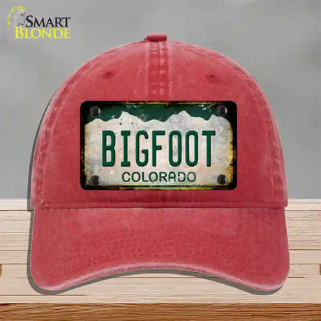 Bigfoot Colorado Rusty Novelty License Plate Hat Unconstructed Cotton / Red