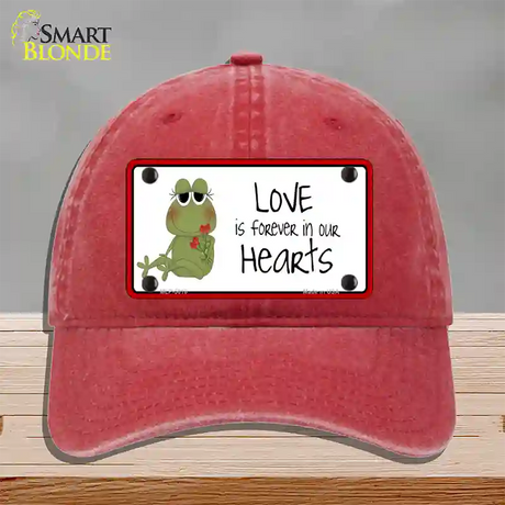 Love In Our Hearts Frog Novelty License Plate Hat Unconstructed Cotton / Red