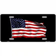 Waving American Flag Black Metal Novelty License Plate 12" x 6" (LP)