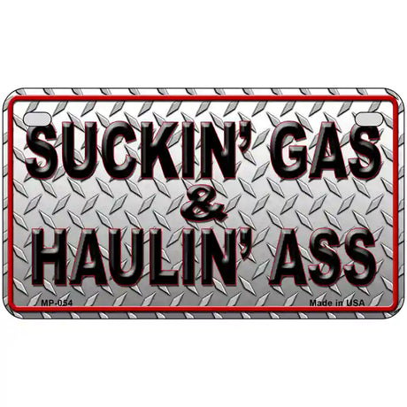 Suckin Gas and Haulin Ass Novelty Metal License Plate 7" x 4" (MP)